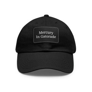 May include: A black baseball cap with a white patch that says "Mercury In Gatorade".