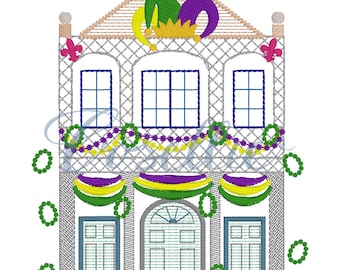 May include: A gray and white building with a purple, green, and yellow jester hat on top. The building has two windows on each side and a large arched doorway. The building is decorated with green, purple, and gold beads and banners.