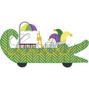 May include: A green alligator-shaped float with a purple and yellow umbrella, a gold trumpet, a drum, and two jester hats. The float has wheels and is decorated with gold beads.