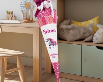 May include: Pink and white school cone with a unicorn design and the name "Helena" and the text "Schulkind 2023".