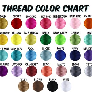 May include: A thread color chart with a variety of colors, including gold, cherry, shocking pink, and orange. The chart displays the names of the colors, such as "Baby Pink," "Navy," and "Silver."