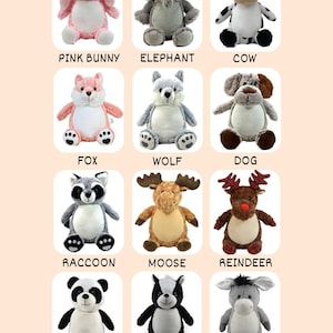 May include: A collection of plush animal toys, including a pink bunny, elephant, cow, fox, wolf, dog, raccoon, moose, reindeer, panda, skunk, and donkey. Each toy has embroidered details and is labeled with its name.