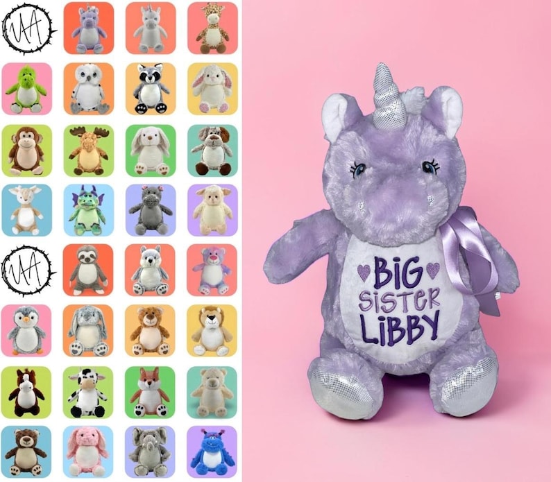 May include: A plush purple unicorn with a silver horn and embroidered text that reads "BIG SISTER LIBBY" on its chest. The unicorn has a satin ribbon and is set against a pink background. A grid of various plush animals is on the left.