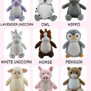 May include: Nine plush stuffed animals, including a lavender unicorn, owl, hippo, white unicorn, horse, penguin, lamb, pig, and cat. Each animal has embroidered details and is displayed on a pink background. The names of the animals are written below each one.
