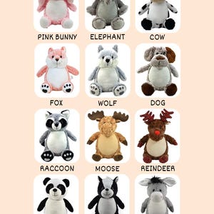 May include: A collection of plush animal toys, including a pink bunny, elephant, cow, fox, wolf, dog, raccoon, moose, reindeer, panda, skunk, and donkey. Each toy has embroidered details and is labeled with its name.