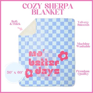 May include: A soft, blue and white checkered sherpa blanket with the text "My Better Days" in pink. The blanket is 50 inches by 60 inches.