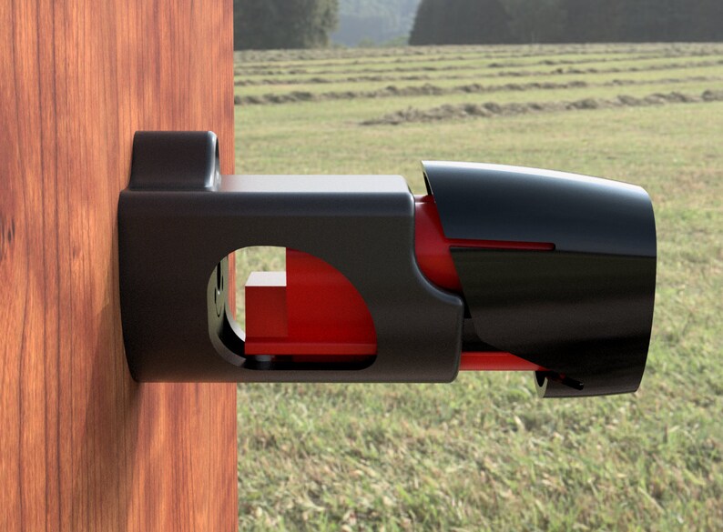 May include: A black metal gate latch with a red release lever. The latch is mounted to a wooden post.