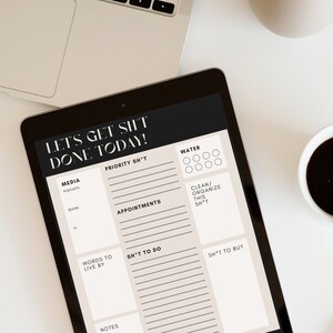 May include: A digital to-do list planner on a tablet screen with the text "Let's Get Sh*t Done Today!" and sections for media, priority, appointments, things to do, and things to buy.