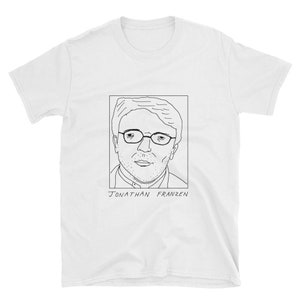 May include: A white t-shirt with a black line drawing of Jonathan Franzen, a well-known author, wearing glasses. The text "Jonathan Franzen" is printed below the drawing.