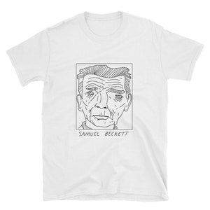 Puede incluir: Una camiseta blanca con un dibujo en línea negra de la cara de Samuel Beckett. El dibujo está en un marco cuadrado con el texto "Samuel Beckett" debajo.