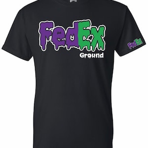 May include: Black t-shirt with a green and purple "FedEx Ground" logo. The logo is dripping, giving it a melted look.