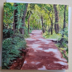 May include: A painting of a path through a forest. The path is lined with trees and green foliage. The path is made of dirt and is lit by the sun.