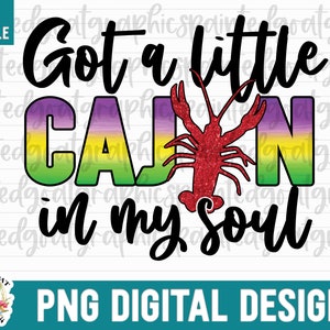 May include: A digital design featuring a colorful graphic of a crawfish with the text "Got a little Cajun in my soul". The text is in black and the crawfish is red with a green, yellow, and purple gradient background.