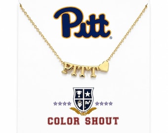 May include: A gold-toned necklace featuring the letters PITT and a small heart charm. The display card shows the blue and gold Pitt logo, a shield emblem with a trophy, star, owl, and flag, and the red text COLOR SHOUT with four stars on each side.