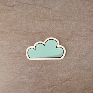 May include: A light blue cloud sticker with a white outline.