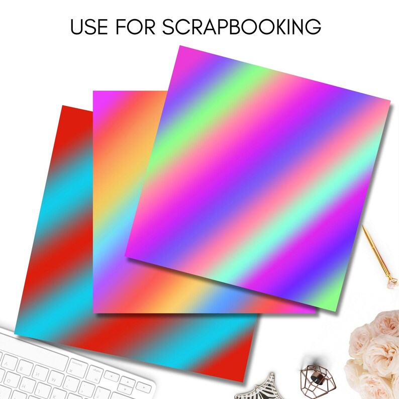 Puede incluir: Tres hojas de papel iridiscente con un patr&oacute;n de degradado arco&iacute;ris. El papel es perfecto para proyectos de scrapbooking y manualidades.