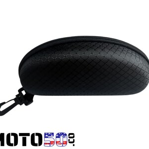 May include: Black zippered case for glasses with a clip. The case has a textured diamond pattern.