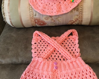 Handmade crocheted baby girl strapp shorts and hat.