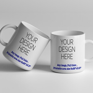 May include: Two white ceramic mugs with black text that reads "YOUR DESIGN HERE". The text is centered on the mug. The mugs are on a white surface. The text below the design reads "Any image, Full Color, Printable area size 8x25"x3.5"".