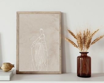 May include: A framed wall art print featuring a white line drawing of a person seen from behind with arms raised overhead. The artwork is set against a solid beige background and enclosed in a light-toned wooden frame with a visible grain texture.