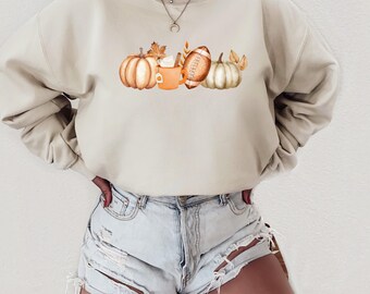 Modna jesienna bluza. Sezonowy okrągły dekolt. Sweter w dynię. Miłośnik kawy. Sezon futbolowy. Jesienne latte. Unisexowy sweter graficzny. Pomysł na prezent.