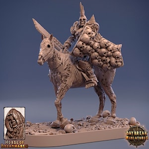 May include: A skeletal figure riding a skeletal horse, both covered in decaying flesh. The figure holds a large shield made entirely of skulls. The figure is wearing a helmet with horns. The base of the miniature is covered in skulls and rocks.