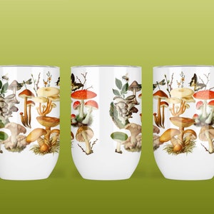 May include: Three white stainless steel tumblers with a mushroom and dragonfly design. The tumblers feature a variety of mushrooms in shades of brown, red, and white, along with a dragonfly in flight.