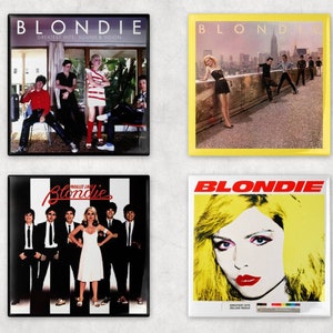 May include: Four different album covers for the band Blondie. The covers feature the band members in various settings, including a city skyline, a striped background, and a yellow background.