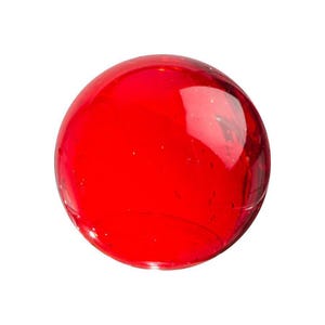 May include: A solid, round, red glass marble. The transparent sphere has a glossy finish and reflects light. The marble is a classic toy, often used in games or as a decorative item. The vibrant red color is eye-catching.