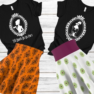 May include: Two black t-shirts with white graphic designs of a woman in a frame. The text on one shirt reads "Till Death Do Us Part". One t-shirt is paired with an orange skirt with a black pattern, and the other is paired with a white skirt with a green floral pattern.