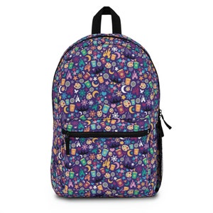 May include: Purple backpack with a colorful pattern of Disney icons, including castles, suns, stars, and lamps.