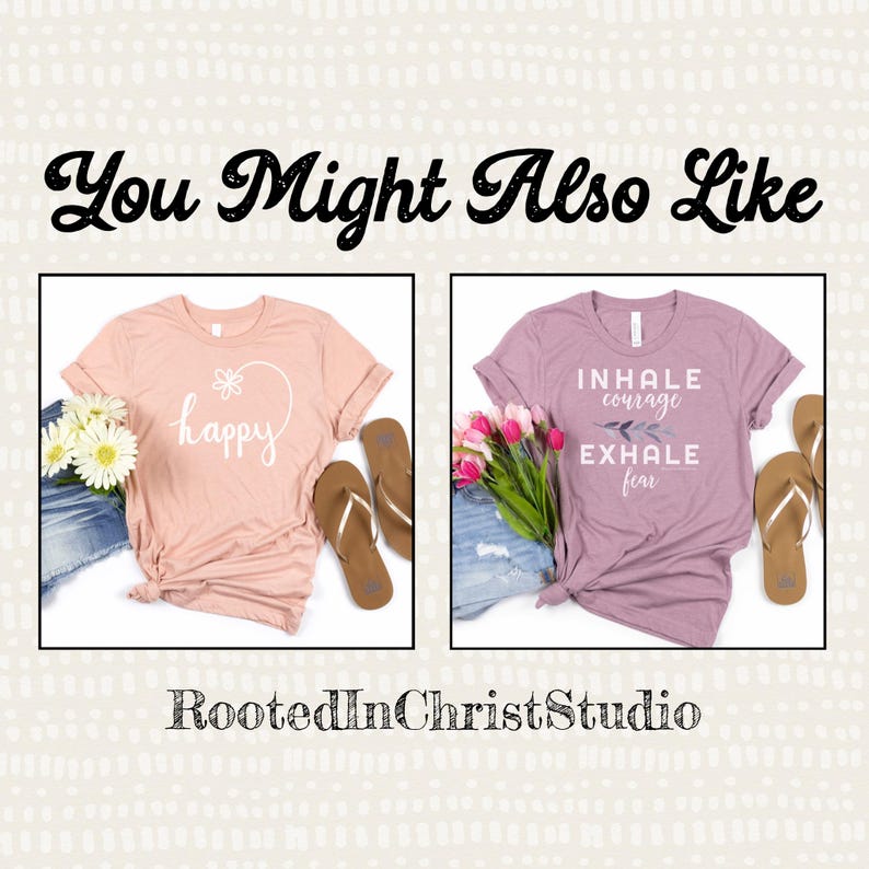 May include: Two t-shirts with different designs. The first t-shirt is pink and says "happy" with a flower in a heart. The second t-shirt is purple and says "inhale courage exhale fear".