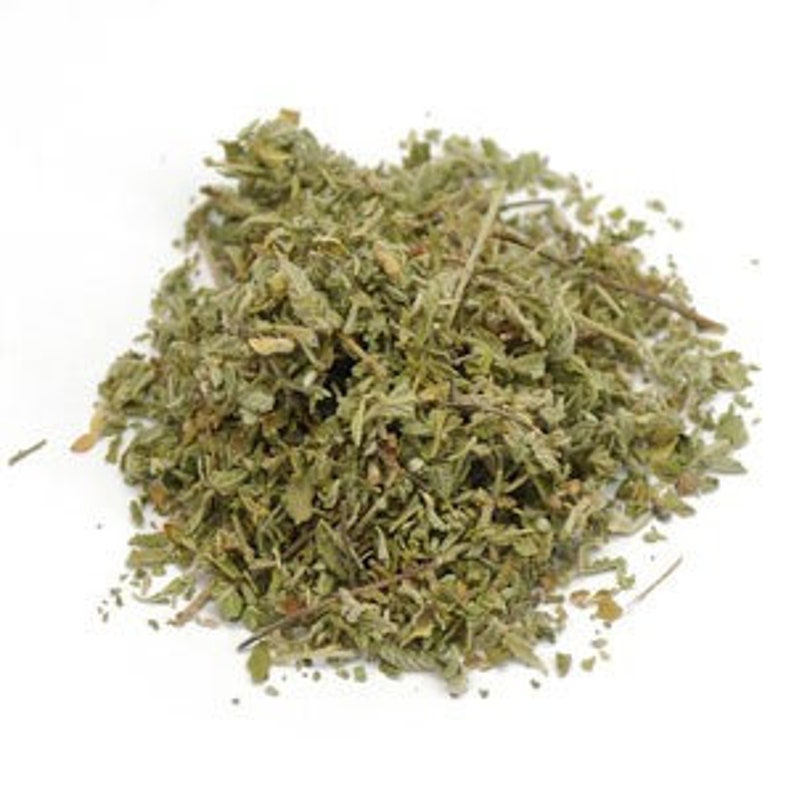 May include: Dried green herb leaves, likely for culinary or medicinal use.
