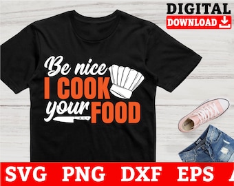 May include: Black t-shirt with white text that reads "Be nice I cook your food". The text is in a bold, orange font. A white chef's hat is above the word "cook".