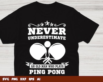 May include: Black t-shirt with white text that reads "Never underestimate an old man who plays ping pong". The text is surrounded by stars and a decorative swirl. Two white ping pong paddles are shown with a white ball in between them.