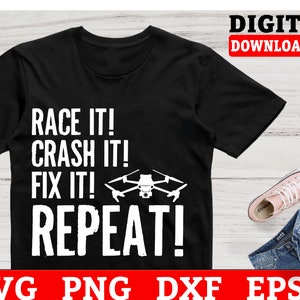 May include: A black t-shirt with white text that reads "Race it! Crash it! Fix it! Repeat!" and a graphic of a drone.