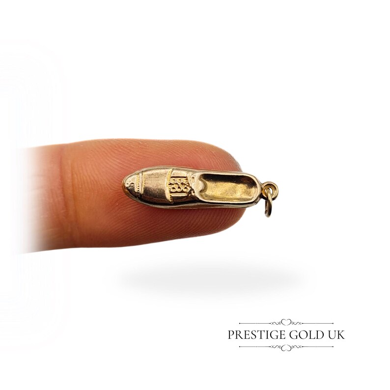 Top view of the 9ct gold hollow loafer charm, highlighting the realistic moccasin-style design and lightweight construction.