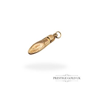 Side view of the lightweight hollow 9ct gold moccasin charm with detailed stitching and smooth polished finish, measuring 24mm in length.