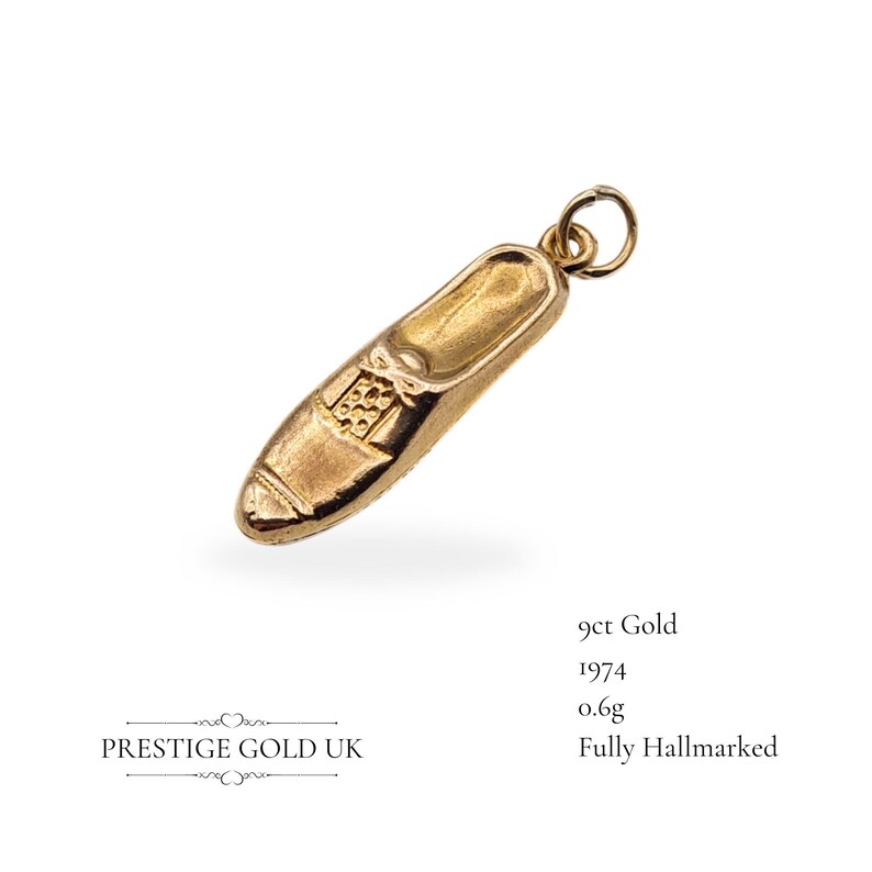 Detailed image of the Birmingham hallmark stamp on the vintage gold charm, confirming its 1974 origin and authenticity.