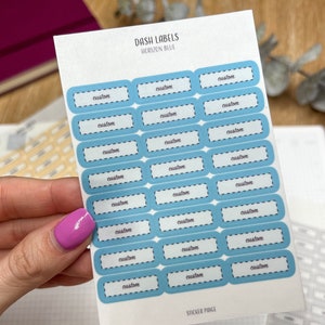 May include: A sheet of blue and white custom dash labels with the text "DASH LABELS HORIZON BLUE" and "STICKER PAGE" printed on the sheet.