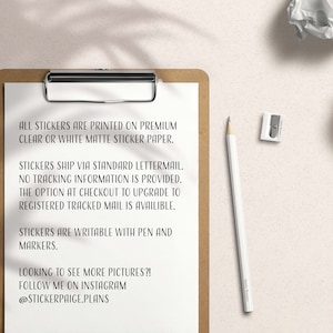 May include: A clipboard with a white sheet of paper containing text about stickers. A white pencil, a pencil sharpener, and two crumpled pieces of paper are on a light beige surface. The text on the paper says the stickers are printed on premium clear or white matte sticker paper.