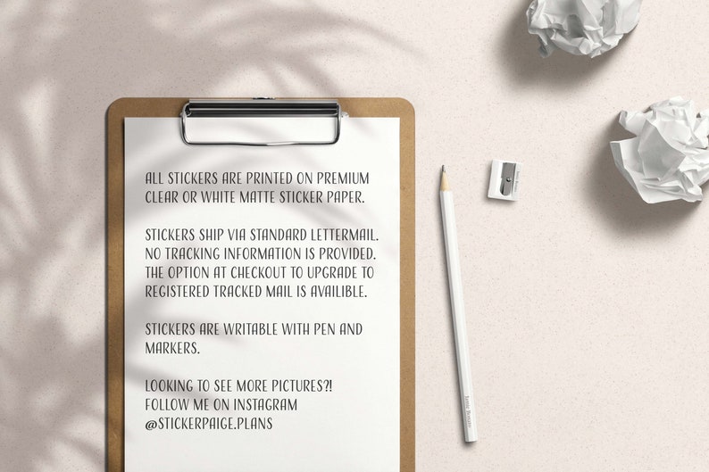 May include: A clipboard with a white sheet of paper containing text about stickers. A white pencil, a pencil sharpener, and two crumpled pieces of paper are on a light beige surface. The text on the paper says the stickers are printed on premium clear or white matte sticker paper.