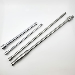 May include: Four chrome-plated socket wrenches of varying lengths, arranged diagonally on a white background. The wrenches have square or hexagonal ends for attaching sockets and are designed for automotive or mechanical work.