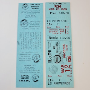 May include: Two vintage blue tickets. One offers a free shrimp dinner at Papa Joe's with a Rockets game stub. The other is a ticket for an NBA basketball game between the Houston Rockets and Phoenix Suns on March 12, 1983, at The Summit.