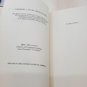May include: An open book with text on the left and right pages. The left page has copyright details, ISBN, and Library of Congress information. The right page has a handwritten dedication. Printed in the United States of America.