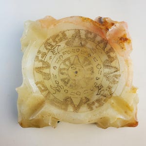Vintage MCM Mayan Calendar Hand Carved Orange Onyx Ashtray with Natural Textures.