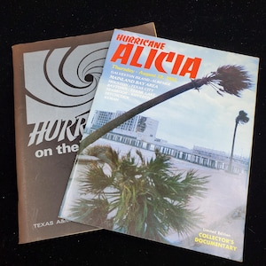 May include: Two vintage documentary publications. The top one is titled "Hurricane Alicia" with a photo of a coastal scene. The bottom publication is brown with the title "HURR on the" and a spiral design. Both are from Texas A&M.