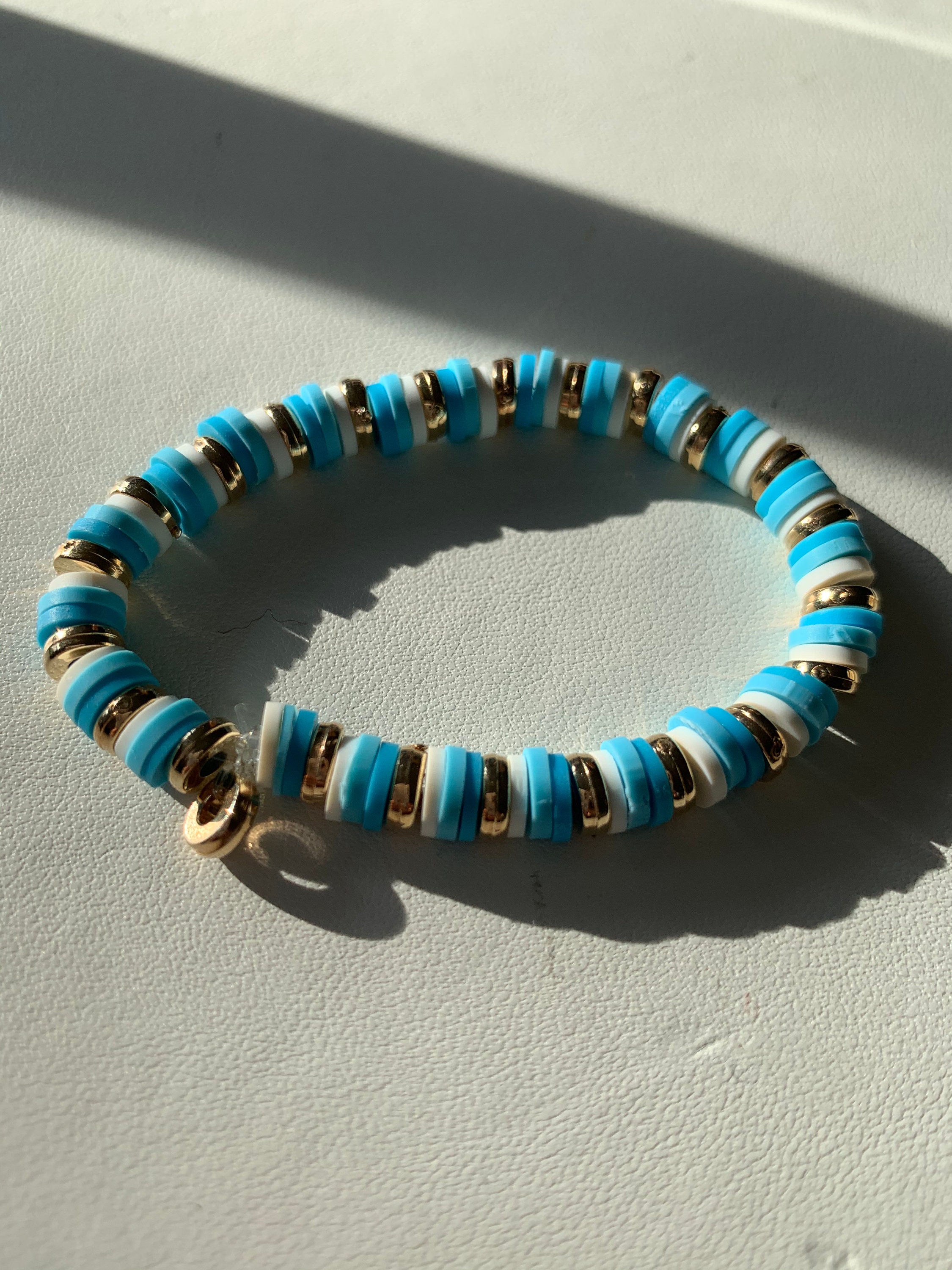 Trendy Blue white and gold clay bead bracelet | Etsy