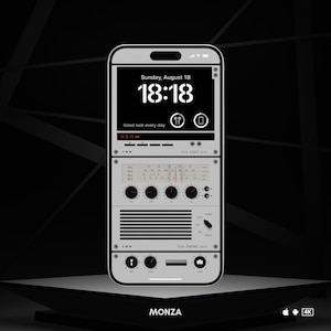 May include: A digital clock app on a smartphone screen displays the time 18:18 with the date Sunday, August 18. The app has a retro design with a radio tuner and control knobs. The text "Good luck every day" is displayed below the clock.