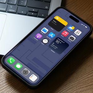 May include: A black smartphone with a dark blue screen displaying various app icons, including Notes, Weather, Calendar, Music, Camera, Podcasts, Clock, and App Store. The phone is on a wooden surface with a laptop and a pair of white earbuds in the background.
